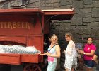 Buying butterbeer. It was delicious, a bit like cream soda.